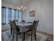 This formal dining room features a chandelier, seating for four, and elegant decor at 1010 Ventura Dr, The Villages, FL 32159