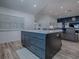 The kitchen island offers seating, ample space and storage at 1010 Ventura Dr, The Villages, FL 32159