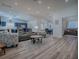 Spacious living area with modern furniture, open to kitchen and dining areas, perfect for entertaining at 1010 Ventura Dr, The Villages, FL 32159