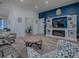 Spacious living room with a fireplace and a view of an office space at 1010 Ventura Dr, The Villages, FL 32159
