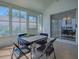 Rear patio with sliding glass door and multiple windows to the outdoor space at 1010 Ventura Dr, The Villages, FL 32159