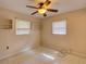 Bedroom with neutral paint and tile floors, complemented by natural light and a ceiling fan at 10166 Cr 671, Bushnell, FL 33513