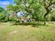 Ranch home is nestled among the mossy trees and tall grasses in an oversized yard at 10166 Cr 671, Bushnell, FL 33513