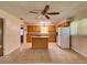 Spacious kitchen showcasing tile flooring, a ceiling fan, a center island and lots of light at 10166 Cr 671, Bushnell, FL 33513