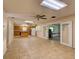 Open living area with lots of space that connects to the kitchen and another living area at 10166 Cr 671, Bushnell, FL 33513