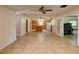 Expansive living area features tile floors, an open layout, and ample natural light, creating a welcoming and versatile space at 10166 Cr 671, Bushnell, FL 33513