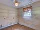 Large utility room with built-in metal shelving and a ceiling fan at 10166 Cr 671, Bushnell, FL 33513