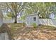 This backyard features a storage shed, healthy trees, and a privacy fence at 10339 Patrick Dr, Leesburg, FL 34788