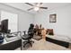 Bedroom featuring ceiling fan and desk setup at 10339 Patrick Dr, Leesburg, FL 34788
