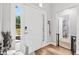 Entryway with door to the outside and view to the bathroom at 10339 Patrick Dr, Leesburg, FL 34788