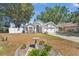 Charming single-story home with a well-manicured lawn and landscaped garden at 10339 Patrick Dr, Leesburg, FL 34788