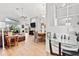 Bright and airy living room with high ceilings, hardwood floors, and large windows allowing ample natural light at 10339 Patrick Dr, Leesburg, FL 34788
