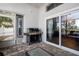 This outdoor patio features a built-in grill, tile flooring, and sliding glass doors at 10339 Patrick Dr, Leesburg, FL 34788