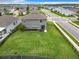 Aerial view showcases the property's expansive, fenced backyard and attractive surroundings within a well-planned community at 1051 Nathan Ridge Rd, Clermont, FL 34715