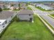 Aerial view of home's backyard with lush green lawn and privacy fence in a beautiful neighborhood at 1051 Nathan Ridge Rd, Clermont, FL 34715