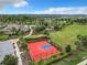 Aerial view of a full basketball court next to other community amenities and green space at 1051 Nathan Ridge Rd, Clermont, FL 34715