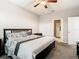Bedroom with a bed featuring patterned bedding, and a ceiling fan with lighting at 1051 Nathan Ridge Rd, Clermont, FL 34715