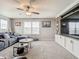 Spacious bonus room with comfortable seating, natural light, and built-in entertainment center at 1051 Nathan Ridge Rd, Clermont, FL 34715