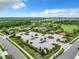 Aerial view of a community center with pool, recreation area, parking, and lush landscaping at 1051 Nathan Ridge Rd, Clermont, FL 34715