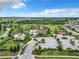 High angle aerial view of the community center featuring a pool area and green space at 1051 Nathan Ridge Rd, Clermont, FL 34715