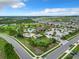 Birds eye view of the community pool, clubhouse, and well-maintained landscaping at 1051 Nathan Ridge Rd, Clermont, FL 34715