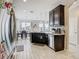 Bright kitchen features stainless steel appliances and opens to the dining area at 1051 Nathan Ridge Rd, Clermont, FL 34715
