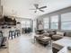 Open-concept living area with eat-in kitchen and adjacent dining space featuring modern decor at 1051 Nathan Ridge Rd, Clermont, FL 34715