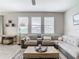 Bright and cozy living room featuring neutral colors and hardwood style flooring at 1051 Nathan Ridge Rd, Clermont, FL 34715