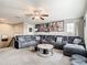 Spacious living room area with plush seating and decorative movie posters at 1051 Nathan Ridge Rd, Clermont, FL 34715