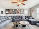 Spacious living room area with plush seating and decorative movie posters at 1051 Nathan Ridge Rd, Clermont, FL 34715