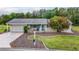 Charming single-story home with attached garage, manicured lawn and landscaping at 10689 Se 174Th Loop, Summerfield, FL 34491