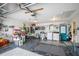 The garage features a side entrance, washer, dryer, epoxy floor, and plenty of storage at 10689 Se 174Th Loop, Summerfield, FL 34491
