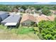 Attractive home showcasing its well-kept lawn and neighborhood surroundings from an aerial perspective at 1159 Greenley Ave, Groveland, FL 34736