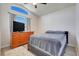 Bright bedroom features vaulted ceiling, modern floors, and a window with natural light at 1159 Greenley Ave, Groveland, FL 34736