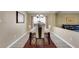 Dining room is furnished with a contemporary table and chairs, set on a patterned rug at 1159 Greenley Ave, Groveland, FL 34736