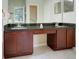 Main bathroom featuring a dual sink vanity and plenty of counter space and natural light at 1159 Greenley Ave, Groveland, FL 34736