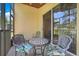 Comfortable screened patio offers a delightful seating area and seamless access to the outdoors at 1159 Greenley Ave, Groveland, FL 34736