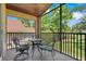 Relaxing screened patio with a cozy seating area and beautiful outdoor views at 1159 Greenley Ave, Groveland, FL 34736