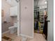 This bathroom has a toilet, a walk-in closet, and accessibility handrails at 11860 Se 179Th St, Summerfield, FL 34491