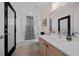 Well-lit bathroom with white quartz countertop, tiled floors, and updated fixtures at 11860 Se 179Th St, Summerfield, FL 34491