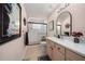 Bathroom featuring a double vanity and frameless walk-in shower at 11860 Se 179Th St, Summerfield, FL 34491