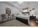 Bedroom featuring natural light, hardwood floors, and modern decor at 11860 Se 179Th St, Summerfield, FL 34491