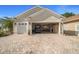 Spacious three-car garage with brick-paved driveway, offering ample parking and storage space at 11860 Se 179Th St, Summerfield, FL 34491
