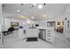 Modern kitchen with white cabinets, stainless steel appliances, and ample counter space at 11860 Se 179Th St, Summerfield, FL 34491