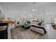 Open-concept living space with modern furnishings, tile flooring, and an inviting atmosphere at 11860 Se 179Th St, Summerfield, FL 34491
