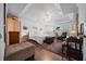 The main bedroom has a tray ceiling, hardwood floors, a lounge area, and a walk in closet at 11860 Se 179Th St, Summerfield, FL 34491
