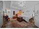 Inviting bedroom with tray ceilings, plush carpeting, stylish furnishings, and ample natural light at 11860 Se 179Th St, Summerfield, FL 34491