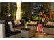 Covered patio area with outdoor furniture and privacy wall at 11860 Se 179Th St, Summerfield, FL 34491