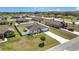 An aerial view showcasing this property's curb appeal and its prime location within a quiet neighborhood at 11995 Callicarpa Ln, Leesburg, FL 34788