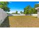 Expansive backyard featuring a well-maintained lawn, a white fence, and plenty of room for outdoor activities at 12150 Se 88Th Ct, Belleview, FL 34420
